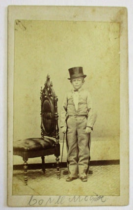 Item #36453 CARTE DE VISITE OF UNKNOWN YOUNG DWARF, POSSIBLY A PERFORMER, STANDING NEXT TO AN...